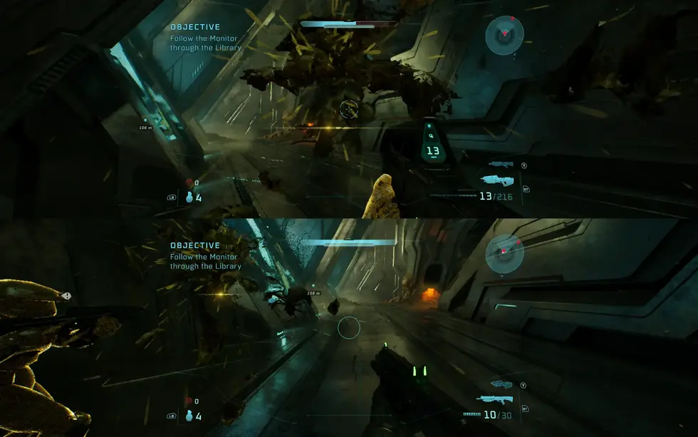 Скриншот из игры Halo: Combat Evolved, где боец в жёлтом костюме следует за монитором в библиотеке космической станции