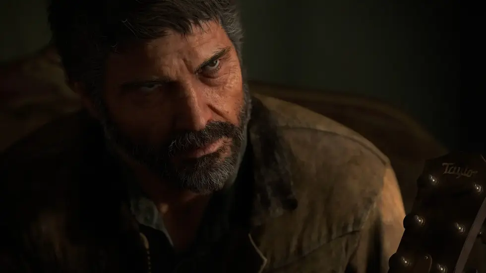 Мужчина с бородой держит гитару в тёмном помещении, кадр из видеоигры The Last of Us
