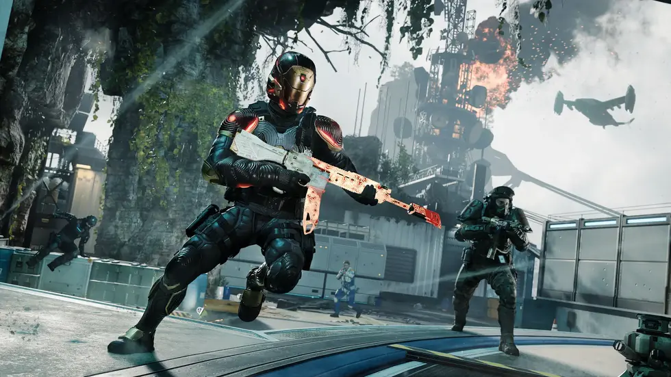 Боец в футуристической броне с автоматом во время сражения в игре Battlefield 2042